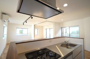 杉並区　マンションリノベーション　Panasonic　インテリアカウンター　対面キッチン　モルタル壁